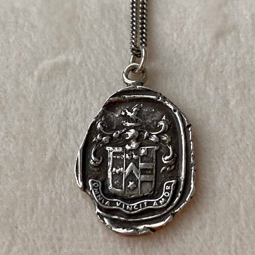 Pyrrha pendant and chain “Love Conquers All”. Oxidized sterling silver.